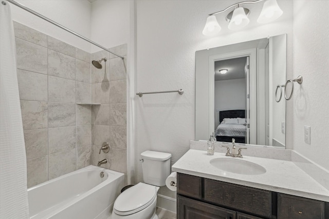 ensuite bathroom featuring shower / bath combo with shower curtain, toilet, ensuite bath, and vanity