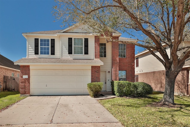 traditional-style house with a front yard, an attached garage, brick siding, and driveway