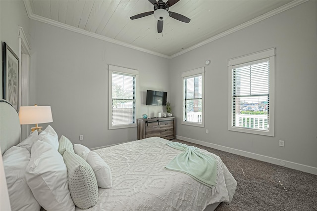 bedroom featuring carpet flooring, a ceiling fan, baseboards, and ornamental molding