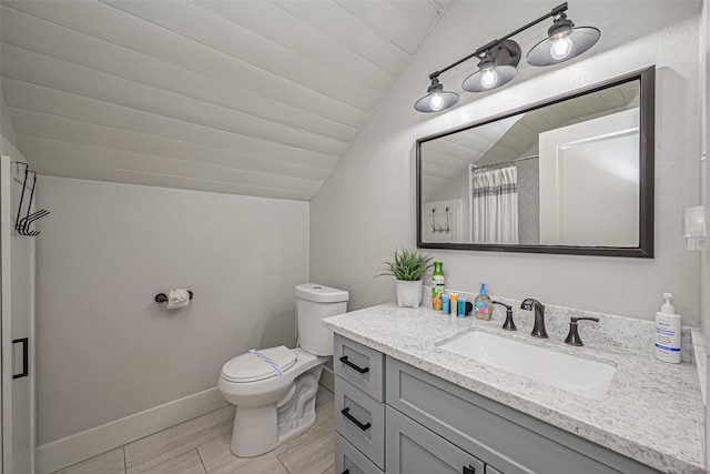 full bath with vanity, vaulted ceiling, toilet, and baseboards