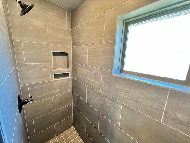 full bath featuring tiled shower