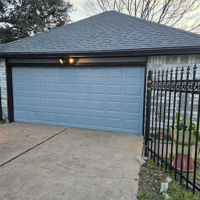 garage with fence