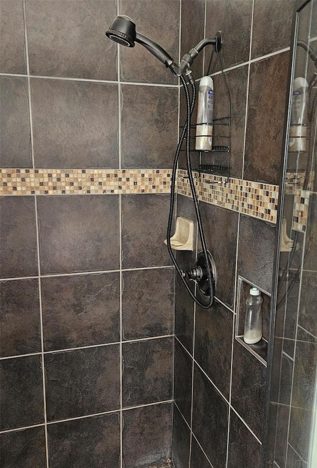 room details with a tile shower