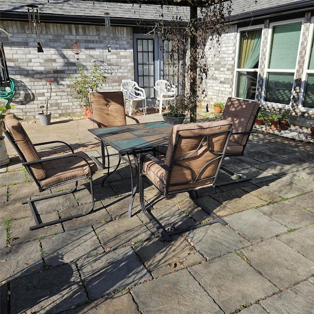 view of patio featuring outdoor dining area