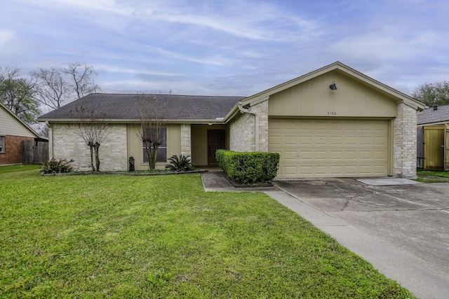 view of front facade featuring an attached garage, concrete driveway, a front yard, and roof with shingles