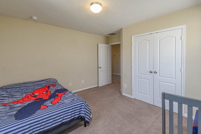 bedroom featuring carpet, visible vents, and baseboards