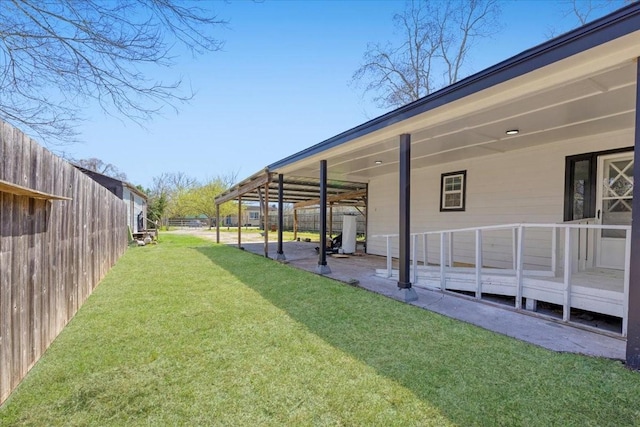 view of yard with a patio and fence