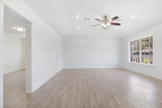 empty room featuring visible vents, baseboards, recessed lighting, ceiling fan, and light wood-style floors