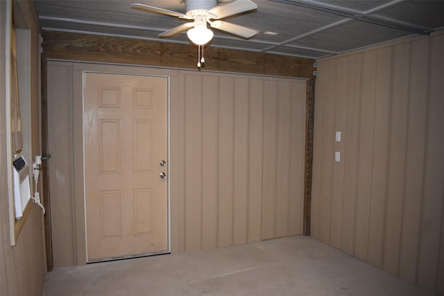 interior space with ceiling fan