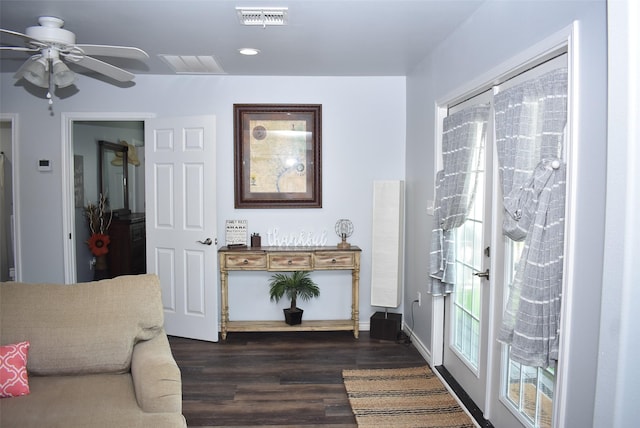 interior space featuring dark wood-style floors, visible vents, recessed lighting, and a ceiling fan