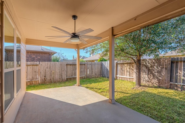 view of patio with a fenced backyard and ceiling fan