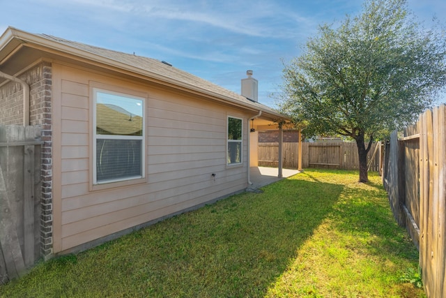 view of yard featuring a patio area and a fenced backyard