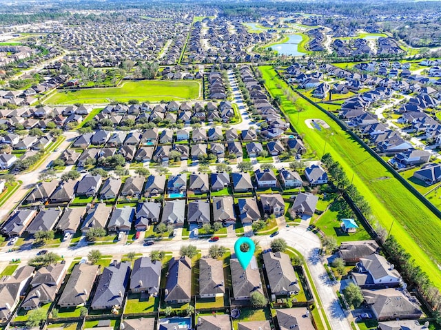 aerial view featuring a residential view and a water view