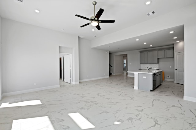 unfurnished living room with recessed lighting, visible vents, marble finish floor, and stairway