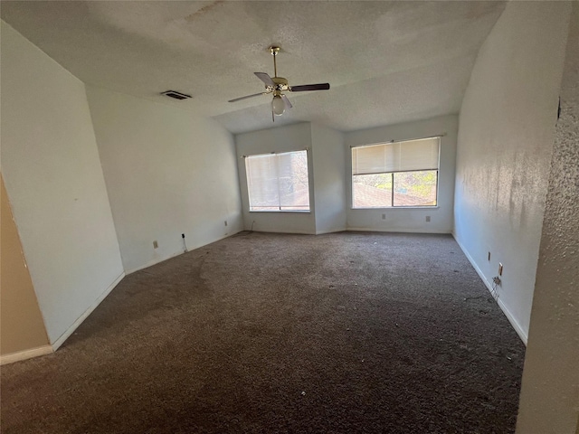 unfurnished room with visible vents, a ceiling fan, a textured ceiling, carpet floors, and baseboards