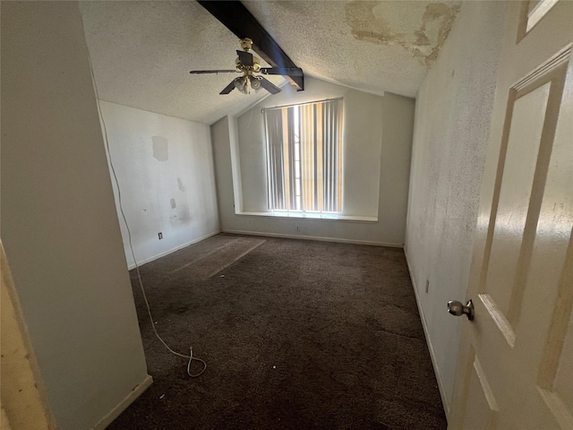 spare room featuring carpet flooring, a textured ceiling, lofted ceiling with beams, and ceiling fan