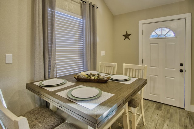 dining space with light wood-type flooring