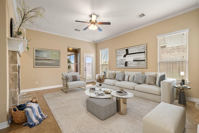 tiled living room featuring visible vents, a ceiling fan, crown molding, and baseboards