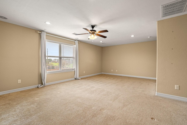 empty room with visible vents, ceiling fan, baseboards, carpet, and recessed lighting