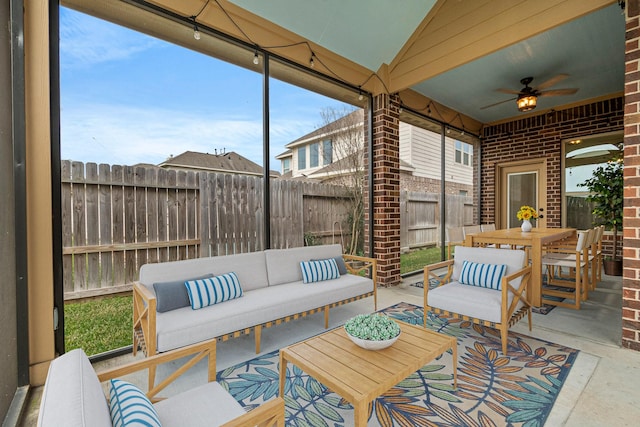 sunroom with vaulted ceiling and ceiling fan