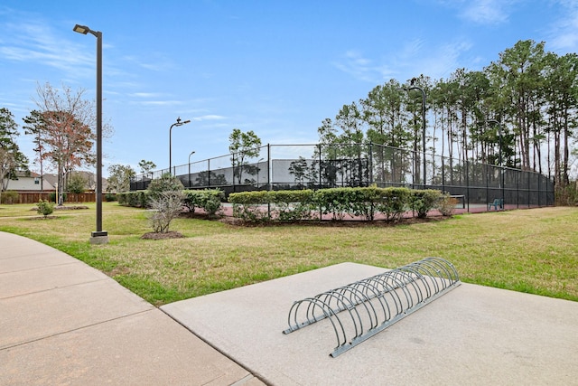 surrounding community with a yard, a patio, and fence