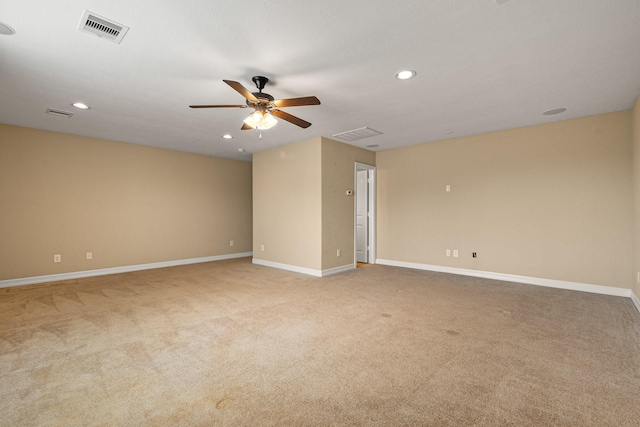 spare room with recessed lighting, visible vents, light colored carpet, and ceiling fan