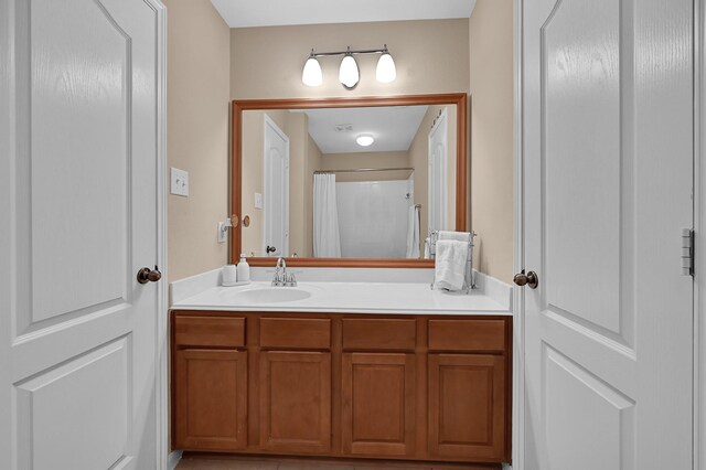 bathroom featuring vanity and a shower with curtain