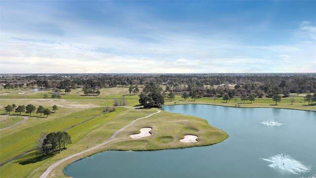 aerial view featuring view of golf course and a water view