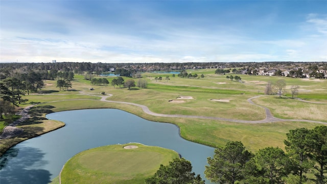 aerial view featuring view of golf course and a water view