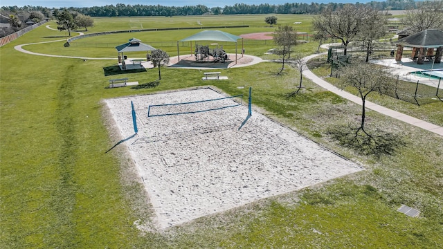 surrounding community featuring a gazebo, a lawn, and volleyball court