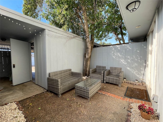 view of patio featuring fence