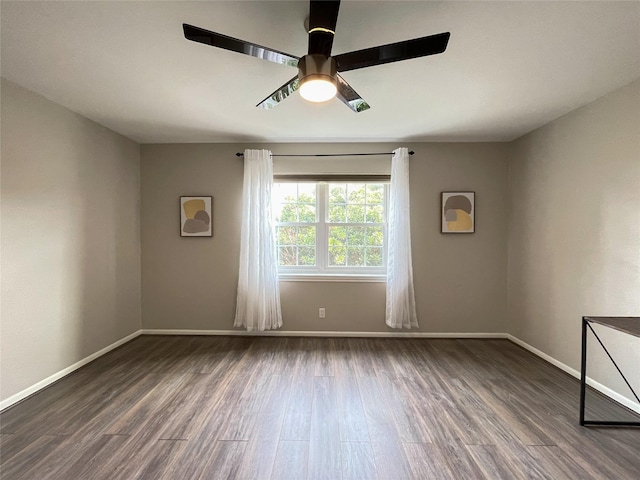 unfurnished room with ceiling fan, baseboards, and wood finished floors