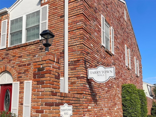 view of home's exterior featuring brick siding