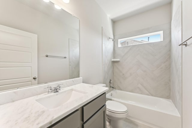 full bath with toilet, vanity, and bathtub / shower combination