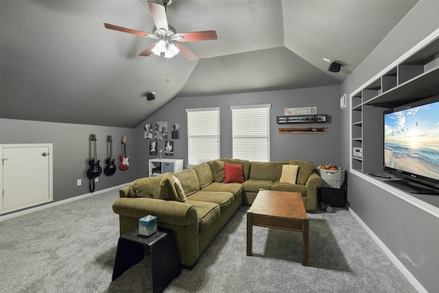 living room with baseboards, lofted ceiling, carpet, and ceiling fan