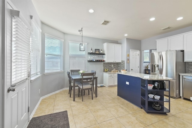 kitchen with open shelves, visible vents, and appliances with stainless steel finishes