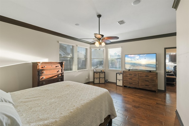 bedroom with dark wood finished floors, visible vents, baseboards, and ornamental molding