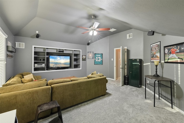 living room with vaulted ceiling, visible vents, carpet floors, and ceiling fan