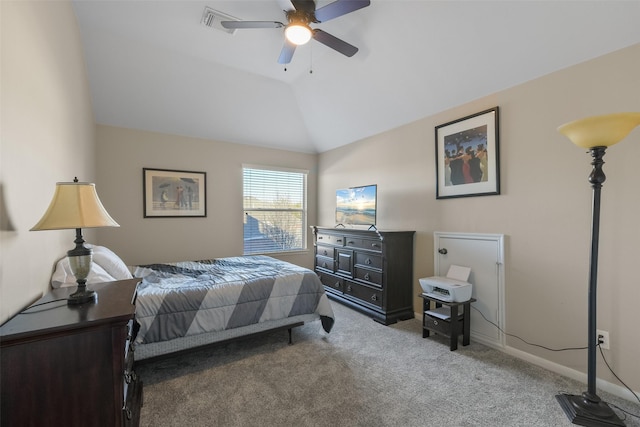 carpeted bedroom featuring baseboards, lofted ceiling, and a ceiling fan