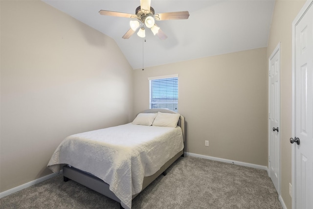 carpeted bedroom featuring ceiling fan, baseboards, and lofted ceiling