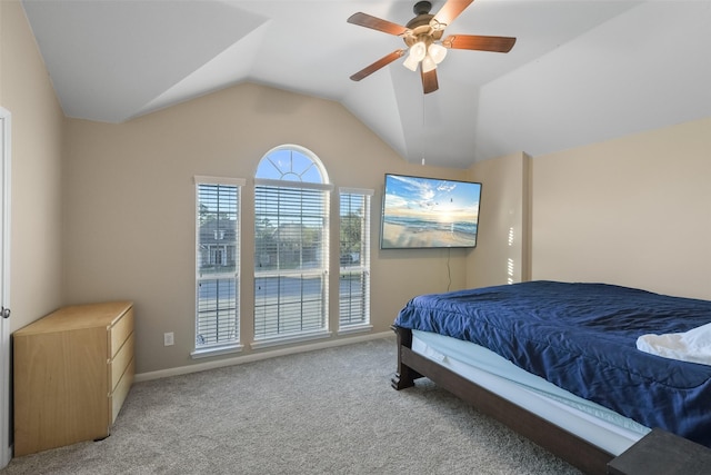 carpeted bedroom featuring baseboards, a ceiling fan, and lofted ceiling