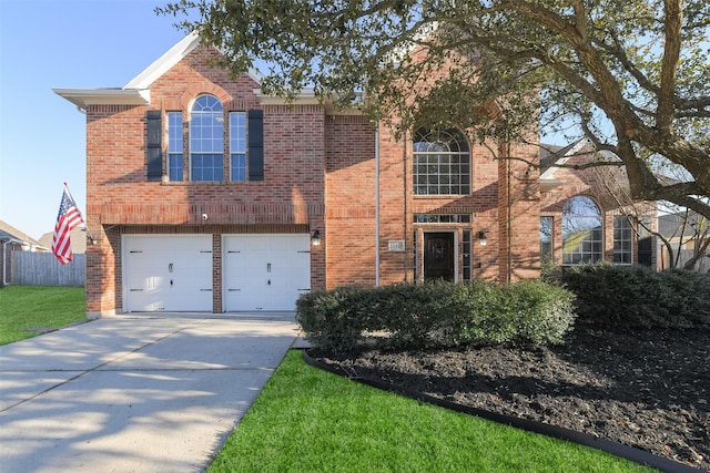 traditional home featuring brick siding, concrete driveway, an attached garage, and fence