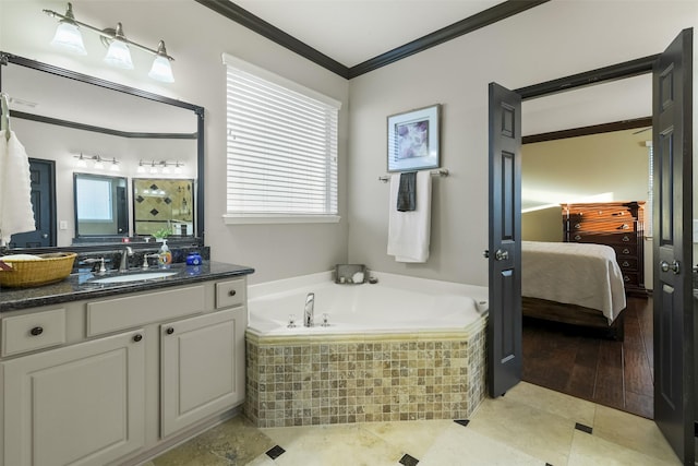 bathroom featuring crown molding, ensuite bath, a garden tub, tile patterned floors, and vanity