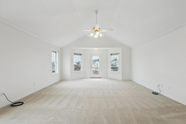 unfurnished living room featuring baseboards, plenty of natural light, light colored carpet, and ceiling fan