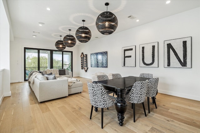 dining space featuring light wood finished floors, recessed lighting, and baseboards