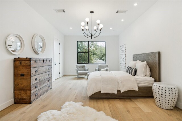 bedroom featuring a chandelier, visible vents, recessed lighting, and light wood-style floors