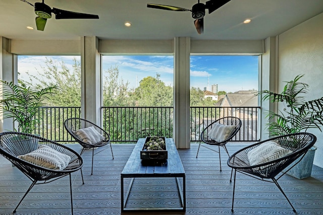 sunroom with a ceiling fan