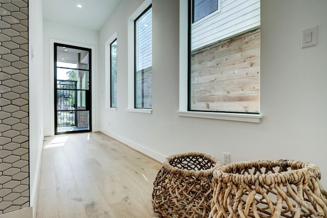 sitting room featuring recessed lighting, baseboards, and wood finished floors