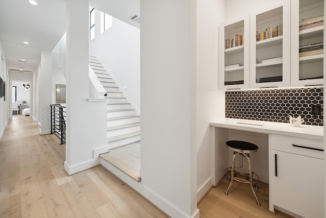 interior space with recessed lighting, visible vents, baseboards, and wood finished floors