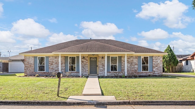 ranch-style house featuring brick siding, roof with shingles, a front lawn, and fence